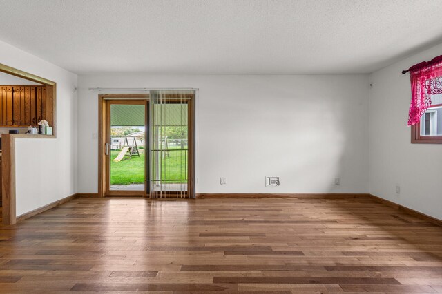 849 N Piatt St, Bement, IL 61813 - unfurnished room featuring wood finished floors and baseboards