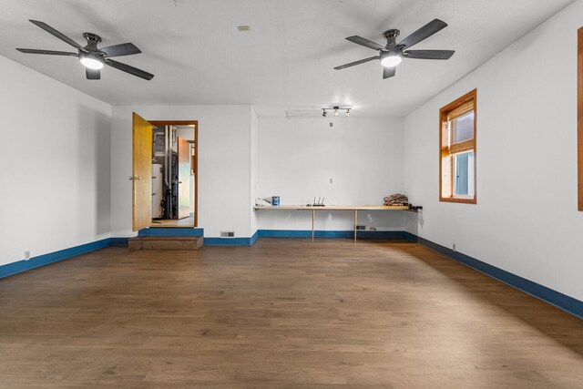 849 N Piatt St, Bement, IL 61813 - unfurnished room with a ceiling fan, wood finished floors, and baseboards