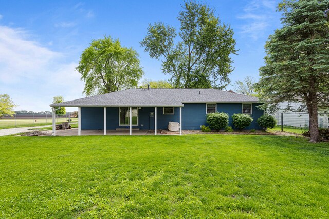 849 N Piatt St, Bement, IL 61813 - back of property featuring a patio area and a carport