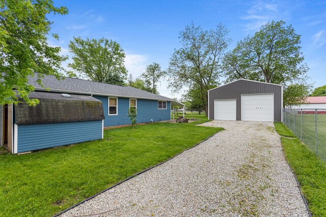 849 N Piatt St, Bement, IL 61813 - view of yard featuring an outdoor structure and a garage