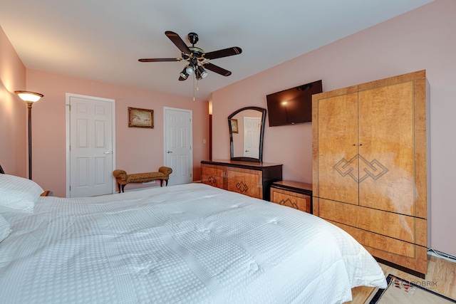 bedroom featuring wood finished floors and ceiling fan