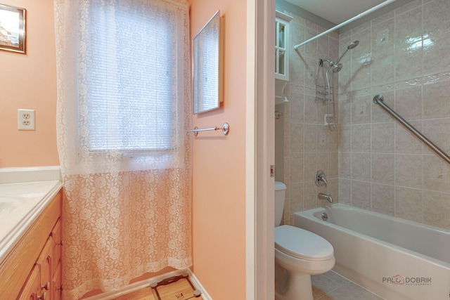 full bathroom with toilet, vanity, and shower / bath combination