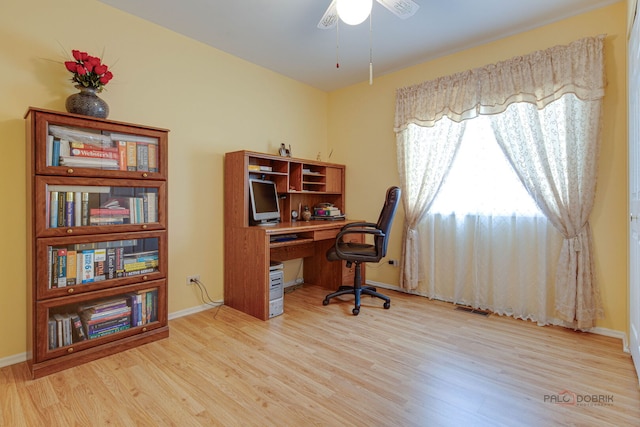 office space with wood finished floors, ceiling fan, and baseboards