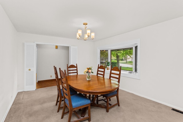112 Braemar Dr, Elk Grove Village, IL 60007 - dining space with a chandelier, light carpet, and baseboards