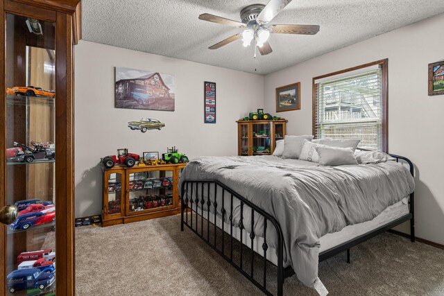 2717 E Main St, Decatur, IL 62521 - bedroom with carpet, a textured ceiling, ceiling fan, and baseboards