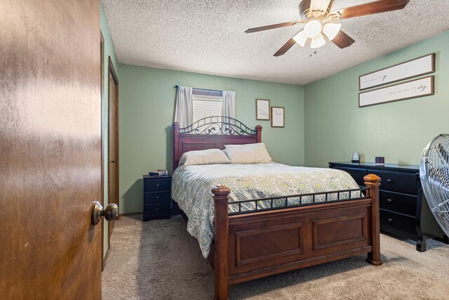 2717 E Main St, Decatur, IL 62521 - bedroom with light carpet, a textured ceiling, and ceiling fan