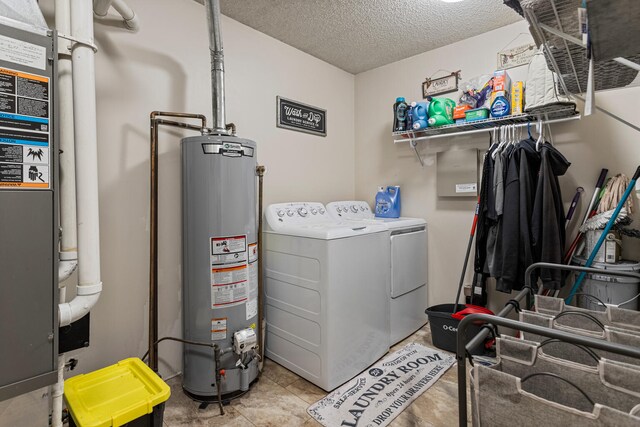 2717 E Main St, Decatur, IL 62521 - laundry area with gas water heater, washing machine and dryer, a textured ceiling, and heating unit
