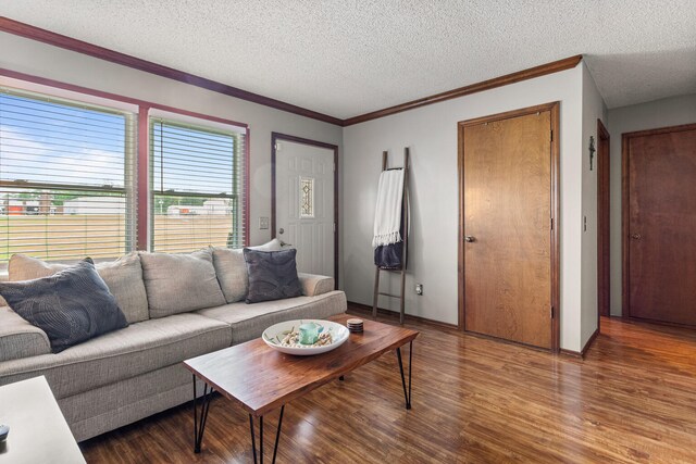 2717 E Main St, Decatur, IL 62521 - living room with wood finished floors, a textured ceiling, and ornamental molding