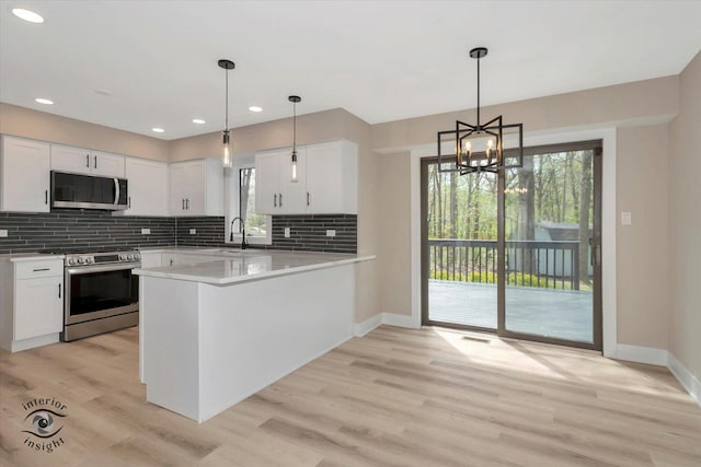 2639 E Shady Grove Ct, Crete, IL 60417 - kitchen with appliances with stainless steel finishes, backsplash, healthy amount of natural light, baseboards, and recessed lighting