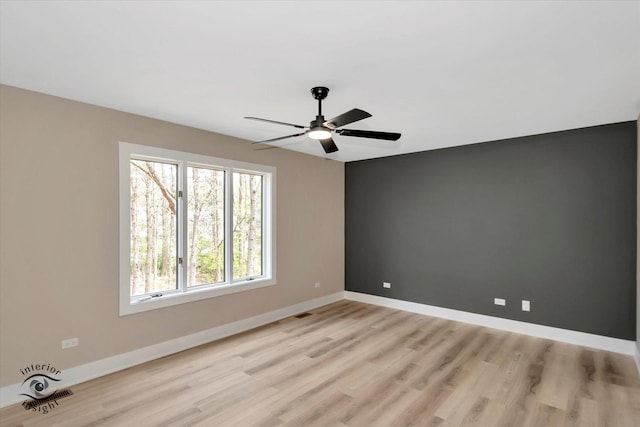 2639 E Shady Grove Ct, Crete, IL 60417 - spare room with light wood-style flooring, ceiling fan, and baseboards