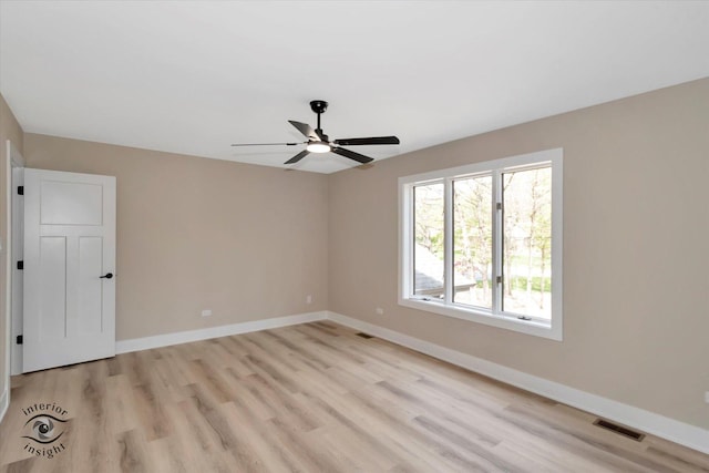 2639 E Shady Grove Ct, Crete, IL 60417 - empty room featuring light wood-type flooring, a ceiling fan, and baseboards
