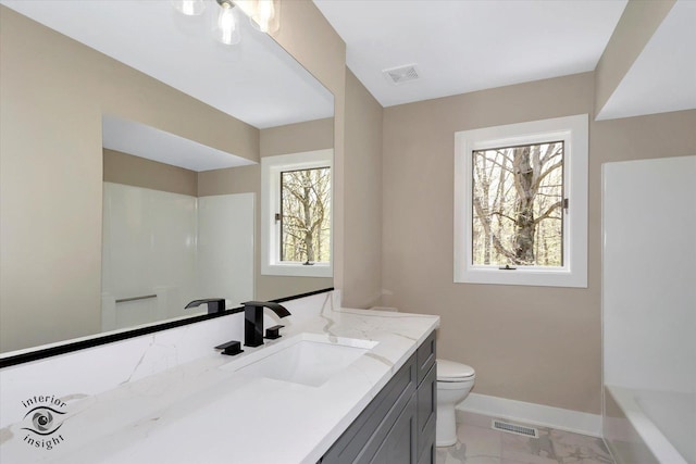 2639 E Shady Grove Ct, Crete, IL 60417 - full bathroom featuring baseboards, toilet, marble finish floors, vanity, and a tub