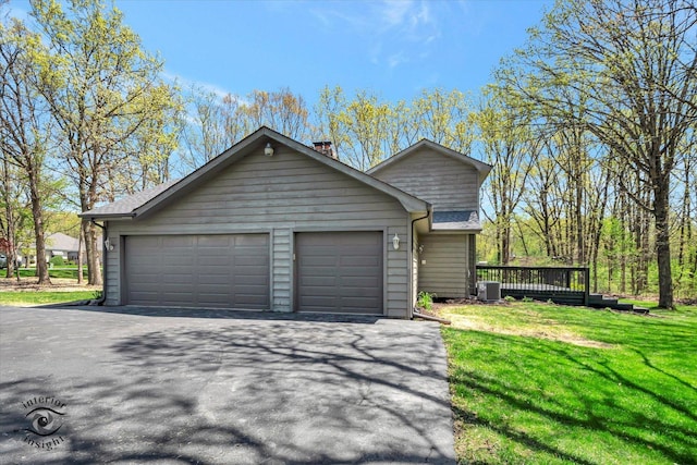 2639 E Shady Grove Ct, Crete, IL 60417 - view of side of home featuring cooling unit, a yard, a chimney, and a garage