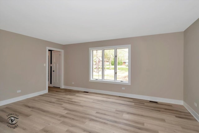 2639 E Shady Grove Ct, Crete, IL 60417 - unfurnished room with light wood-style floors and baseboards