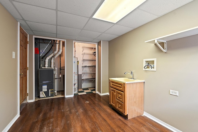 6407 182nd St, Tinley Park, IL 60477 - laundry room with gas water heater, dark wood-type flooring, baseboards, and washer hookup