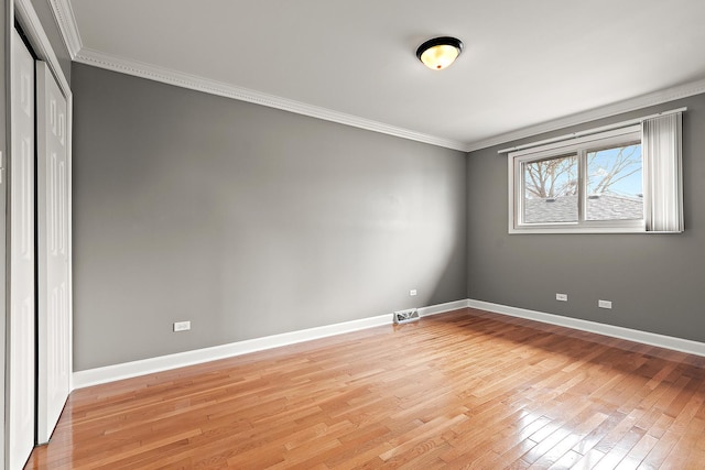6407 182nd St, Tinley Park, IL 60477 - spare room featuring ornamental molding, light wood finished floors, and baseboards