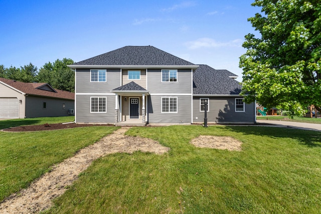 2012 Spruce Ln, Monticello, IL 61856 - view of front of home with a front yard and roof with shingles