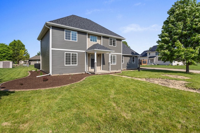 2012 Spruce Ln, Monticello, IL 61856 - view of front of home with a front lawn and roof with shingles