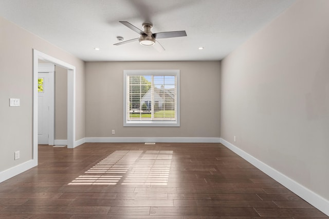 2012 Spruce Ln, Monticello, IL 61856 - spare room featuring ceiling fan, dark wood finished floors, baseboards, and recessed lighting