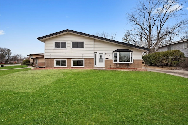 236 Early St, Park Forest, IL 60466 - rear view of property with brick siding and a lawn