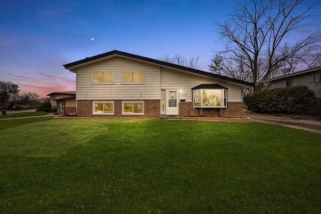 236 Early St, Park Forest, IL 60466 - rear view of property with a lawn and brick siding
