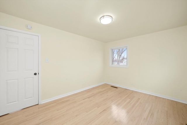 236 Early St, Park Forest, IL 60466 - spare room featuring baseboards and light wood-type flooring