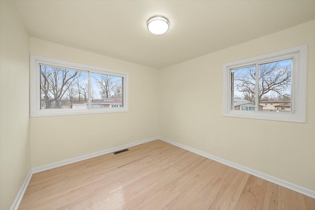 236 Early St, Park Forest, IL 60466 - empty room featuring wood finished floors and baseboards