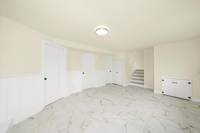 236 Early St, Park Forest, IL 60466 - spare room with stairway, light marble finish flooring, and wainscoting