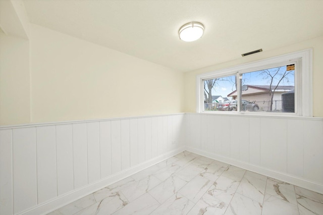 236 Early St, Park Forest, IL 60466 - empty room featuring a wainscoted wall and light marble finish floors