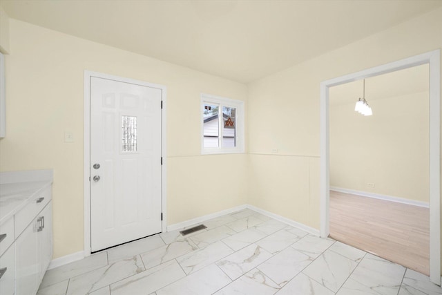 236 Early St, Park Forest, IL 60466 - entryway featuring light marble finish flooring and baseboards
