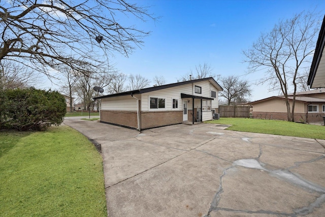 236 Early St, Park Forest, IL 60466 - back of house featuring brick siding and a patio area