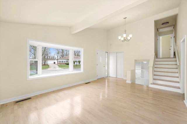236 Early St, Park Forest, IL 60466 - unfurnished living room featuring a chandelier, light wood-style flooring, and stairway