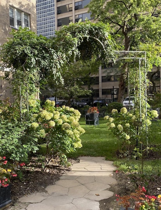 view of property's community featuring fence