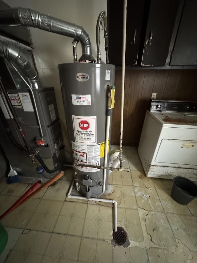 utilities with gas water heater and washer / dryer