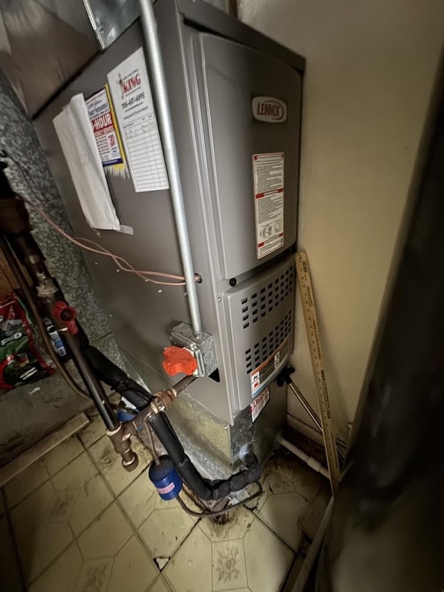 utility room with heating unit