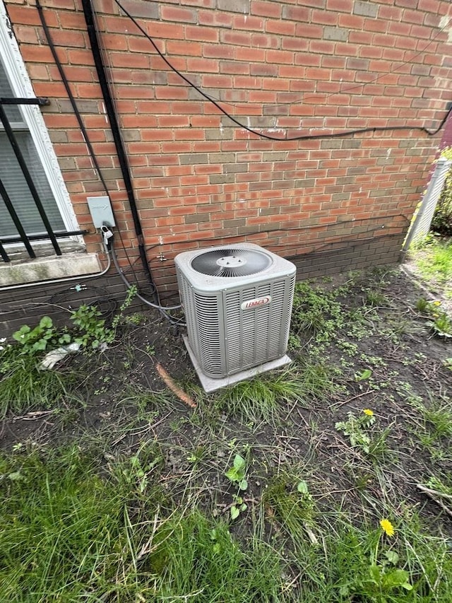 exterior view of central AC and brick siding