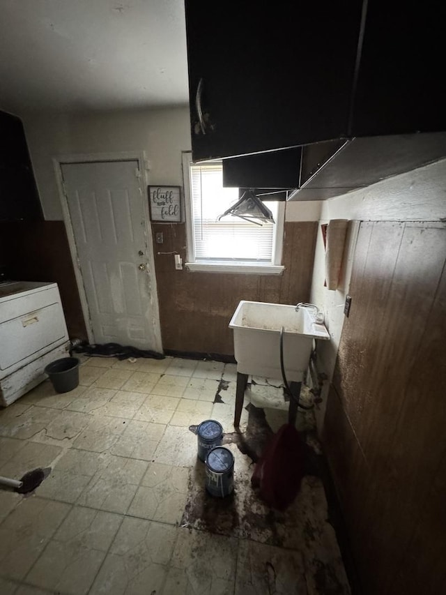 kitchen with tile patterned floors and a sink