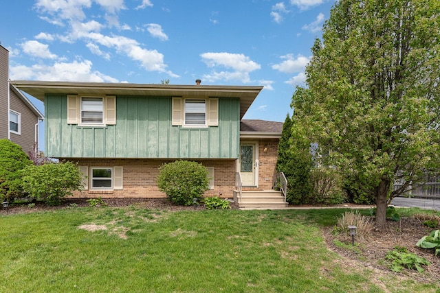 1339 Addleman St, Joliet, IL 60431 - split level home featuring brick siding, board and batten siding, and a front lawn