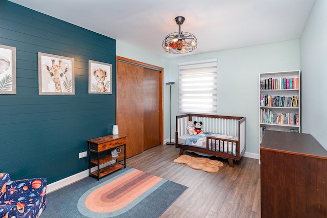 1339 Addleman St, Joliet, IL 60431 - bedroom with wood finished floors, baseboards, and a closet