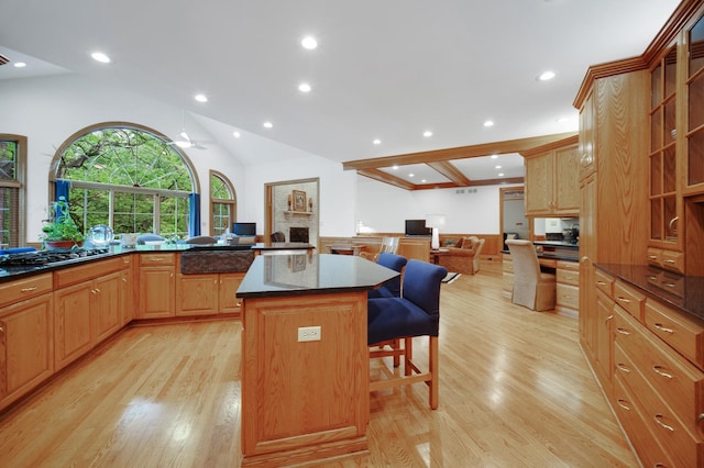 160 Circle Ridge Dr, Burr Ridge, IL 60527 - kitchen featuring gas cooktop, a kitchen bar, light wood-type flooring, a kitchen island, and recessed lighting
