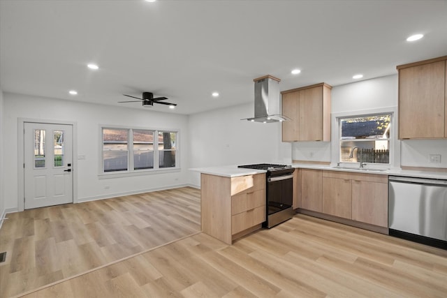 1416 3rd St, Winthrop Harbor, IL 60096 - kitchen with stainless steel appliances, wall chimney range hood, light brown cabinets, a sink, and a peninsula