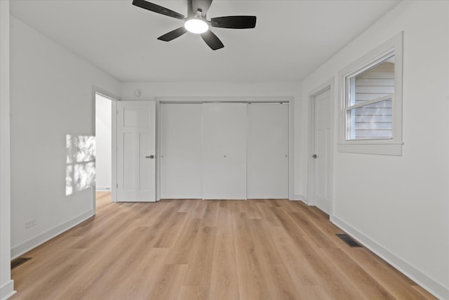 1416 3rd St, Winthrop Harbor, IL 60096 - unfurnished bedroom featuring light wood-style floors, a closet, baseboards, and a ceiling fan