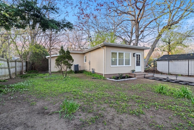 1416 3rd St, Winthrop Harbor, IL 60096 - view of property exterior featuring fence and central AC unit