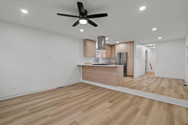 1416 3rd St, Winthrop Harbor, IL 60096 - kitchen with freestanding refrigerator, wall chimney exhaust hood, a peninsula, light wood finished floors, and recessed lighting