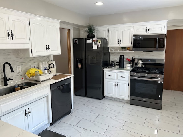 7700 Le Claire Ave, Skokie, IL 60077 - kitchen featuring black appliances, light marble finish flooring, a sink, white cabinetry, and recessed lighting
