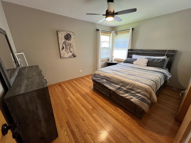 7700 Le Claire Ave, Skokie, IL 60077 - bedroom with light wood-type flooring, baseboards, and a ceiling fan