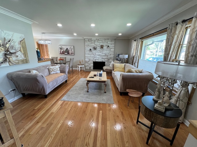 7700 Le Claire Ave, Skokie, IL 60077 - living room featuring crown molding, a stone fireplace, light wood-type flooring, recessed lighting, and baseboards
