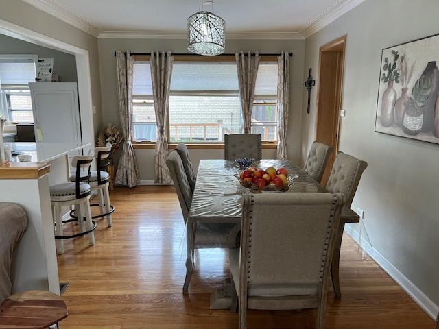 7700 Le Claire Ave, Skokie, IL 60077 - dining room featuring healthy amount of natural light, ornamental molding, light wood-type flooring, and baseboards