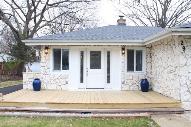 29 S Ash St, Palatine, IL 60067 - back of house featuring stone siding, a chimney, roof with shingles, and a deck