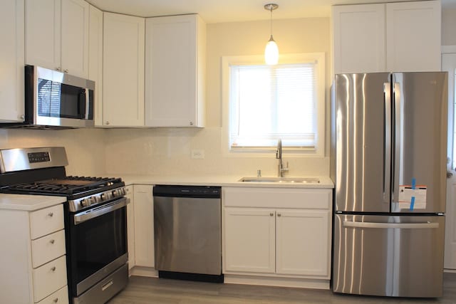 29 S Ash St, Palatine, IL 60067 - kitchen featuring appliances with stainless steel finishes, a sink, and white cabinets